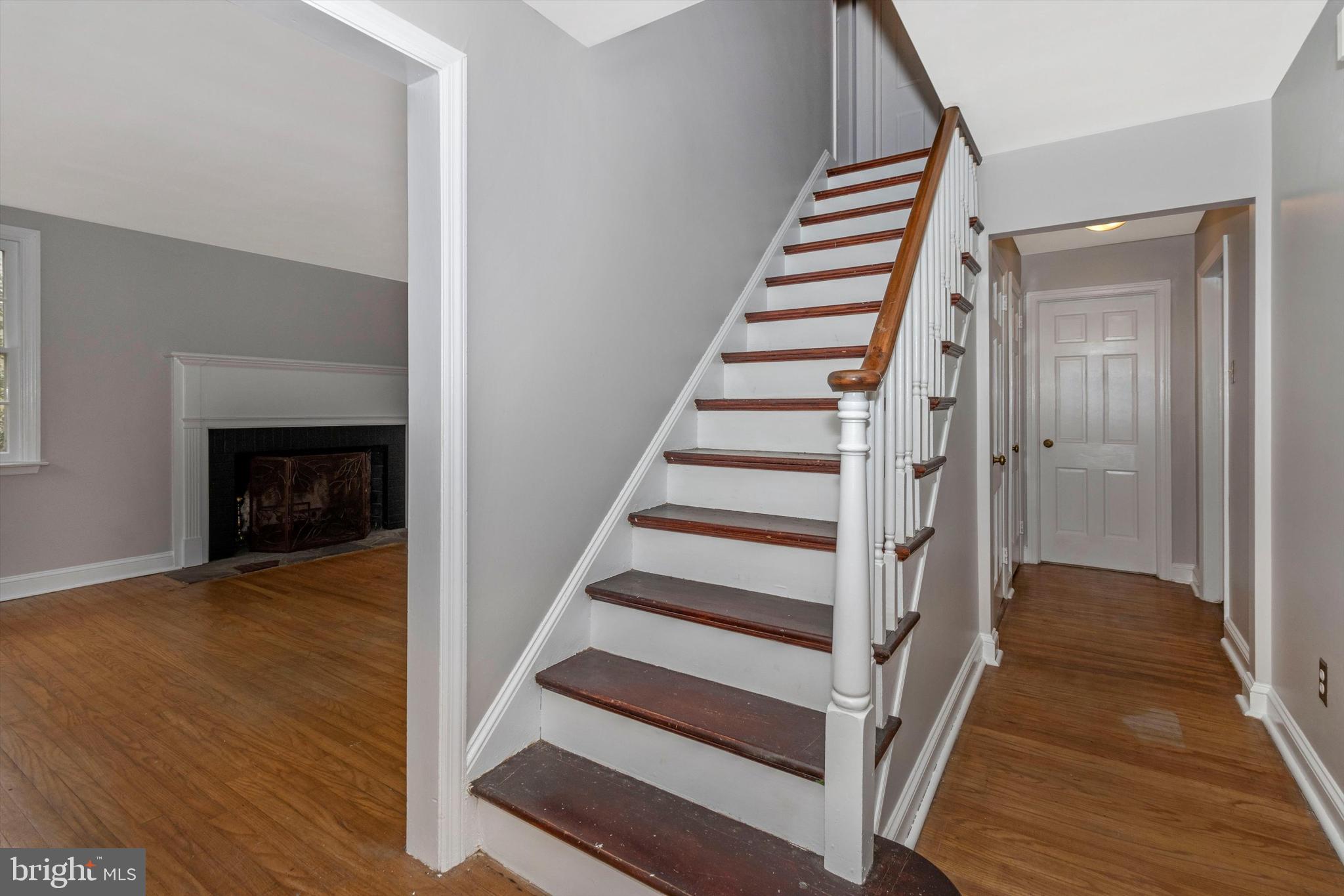 414 Devon State Road Devon, PA 19333 - Photo 16 of 31 a view of a hallway with wooden floor and staircase