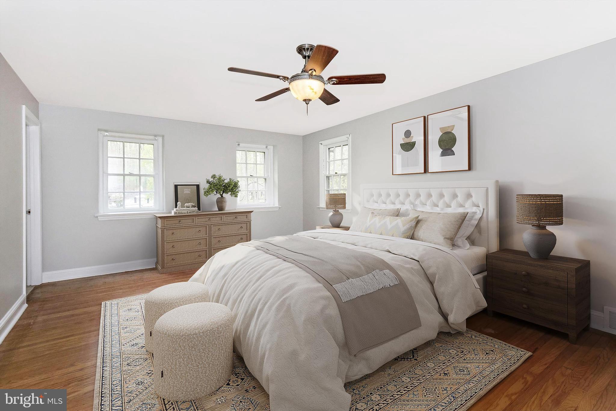 414 Devon State Road Devon, PA 19333 - Photo 18 of 31 a spacious bedroom with a bed and a chandelier
