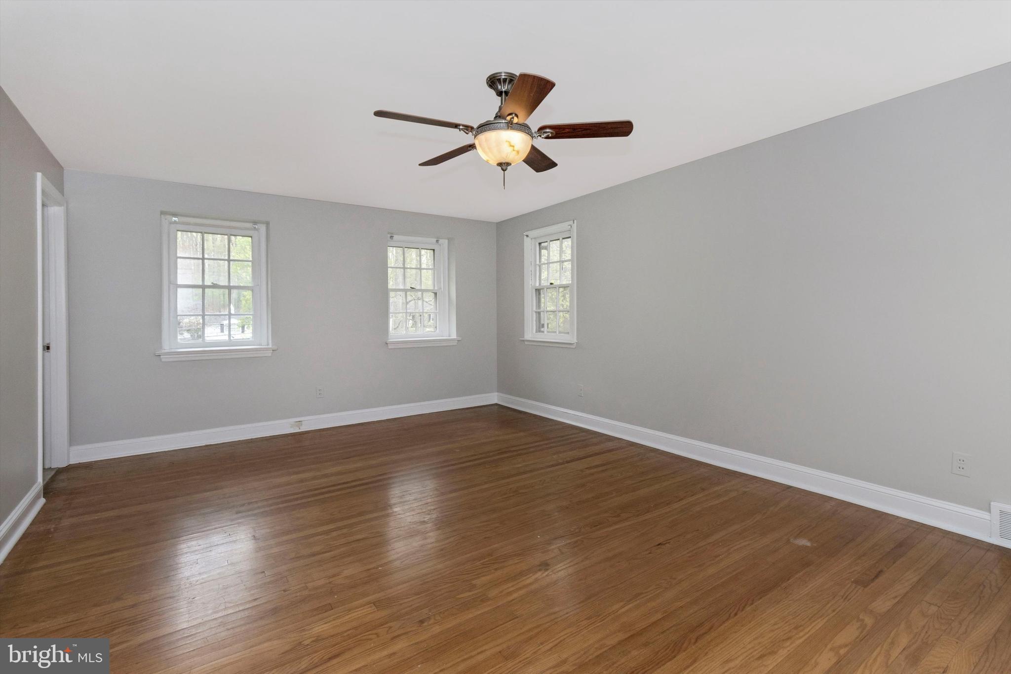 414 Devon State Road Devon, PA 19333 - Photo 19 of 31 a view of empty room with wooden floor and fan