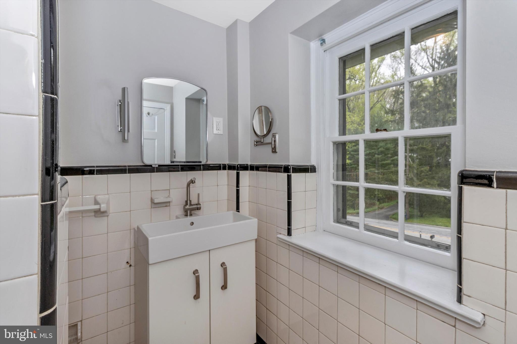 414 Devon State Road Devon, PA 19333 - Photo 21 of 31 a bathroom with a sink a vanity and a mirror