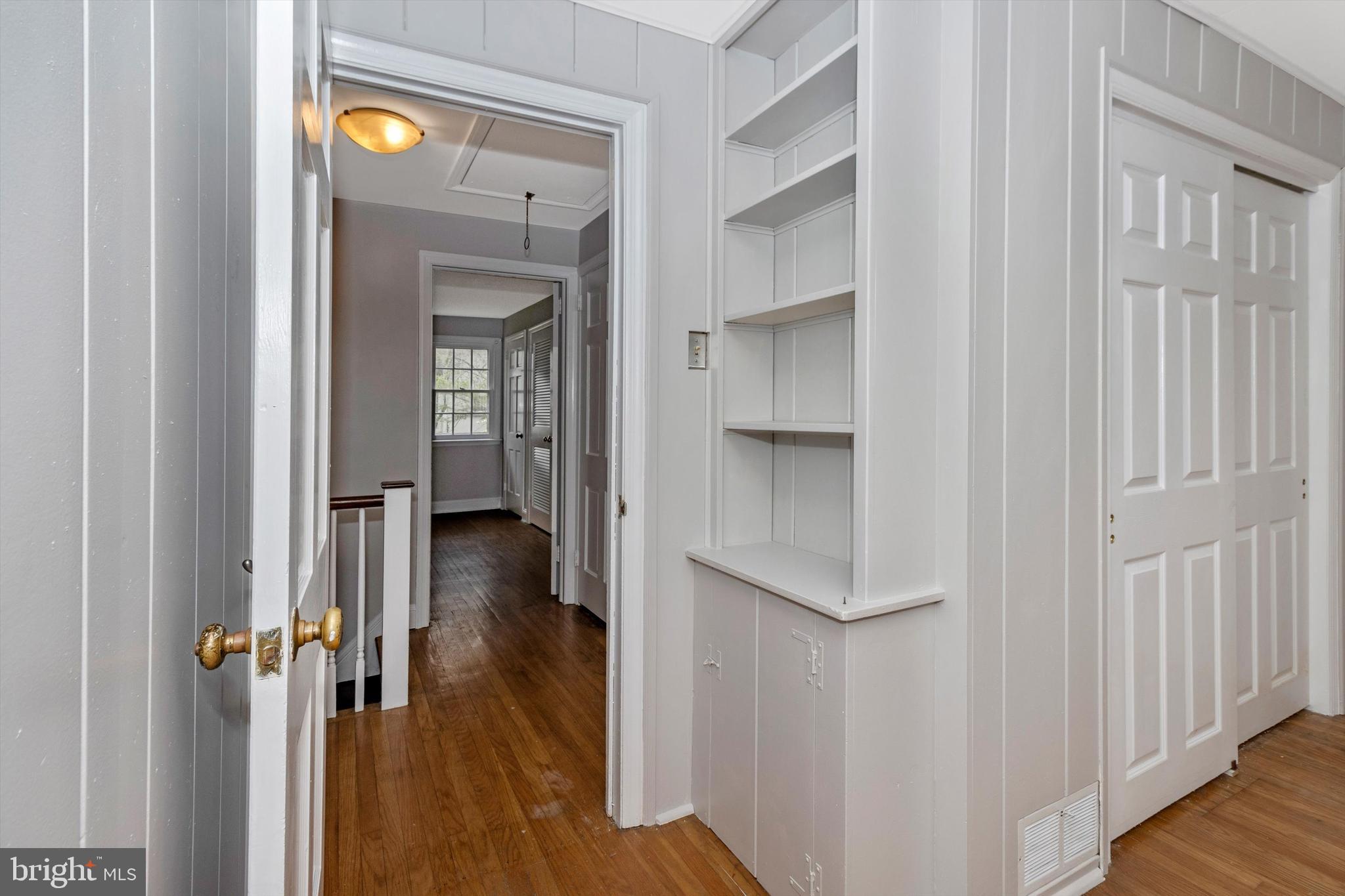 414 Devon State Road Devon, PA 19333 - Photo 26 of 31 a view of a hallway with wooden floor and staircase