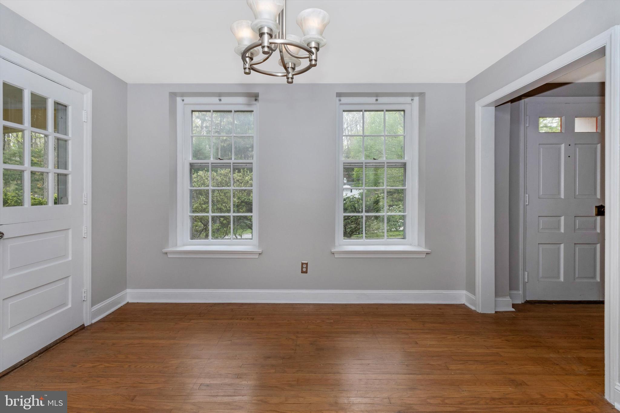 414 Devon State Road Devon, PA 19333 - Photo 9 of 31 a view of an empty room with wooden floor and a window