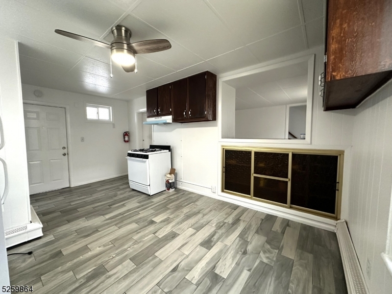 89 Getty Avenue, Unit 3 Clifton, NJ 07011 - Photo 11 of 28 a view of a livingroom with a kitchen