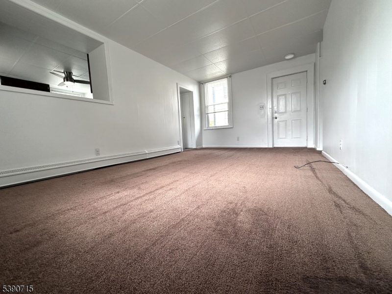 89 Getty Avenue, Unit 3 Clifton, NJ 07011 - Photo 13 of 28 an empty room with windows