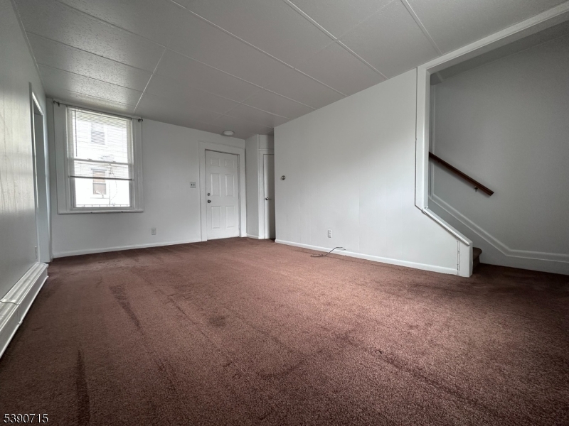89 Getty Avenue, Unit 3 Clifton, NJ 07011 - Photo 14 of 28 an empty room with windows