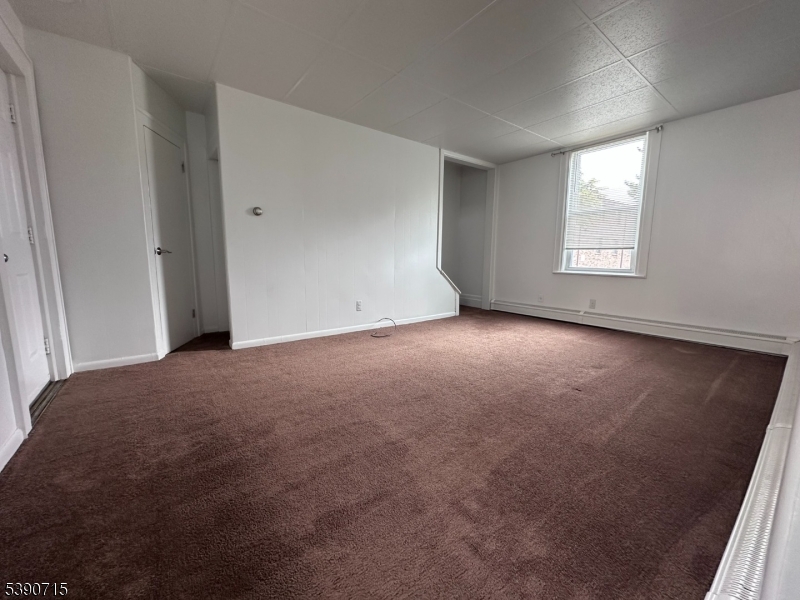89 Getty Avenue, Unit 3 Clifton, NJ 07011 - Photo 15 of 28 a view of an empty room with a window