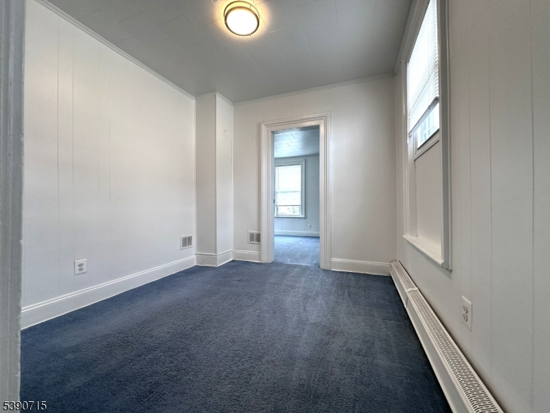 89 Getty Avenue, Unit 3 Clifton, NJ 07011 - Photo 18 of 28 an empty room with windows