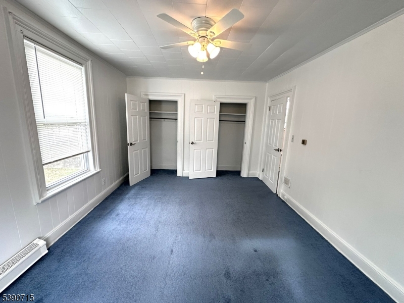 89 Getty Avenue, Unit 3 Clifton, NJ 07011 - Photo 22 of 28 wooden floor in an empty room with a window