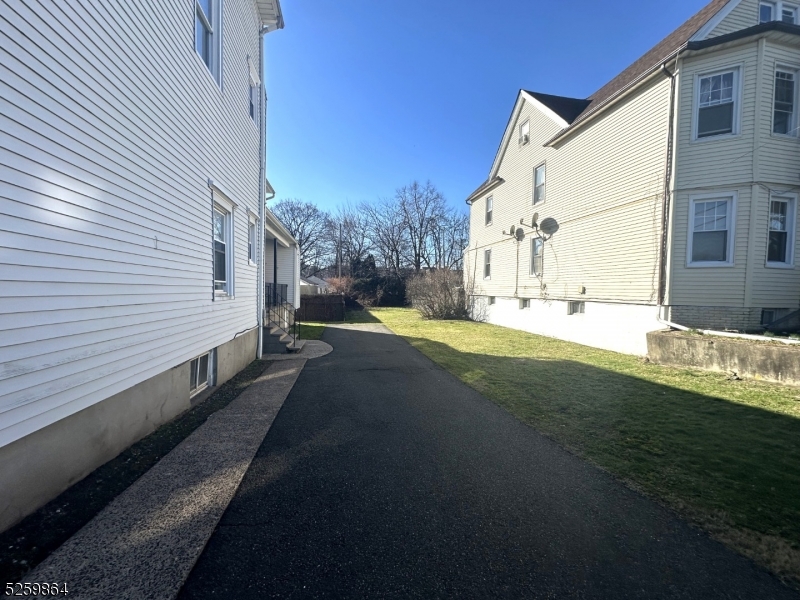 89 Getty Avenue, Unit 3 Clifton, NJ 07011 - Photo 28 of 28 a view of a back yard of the house