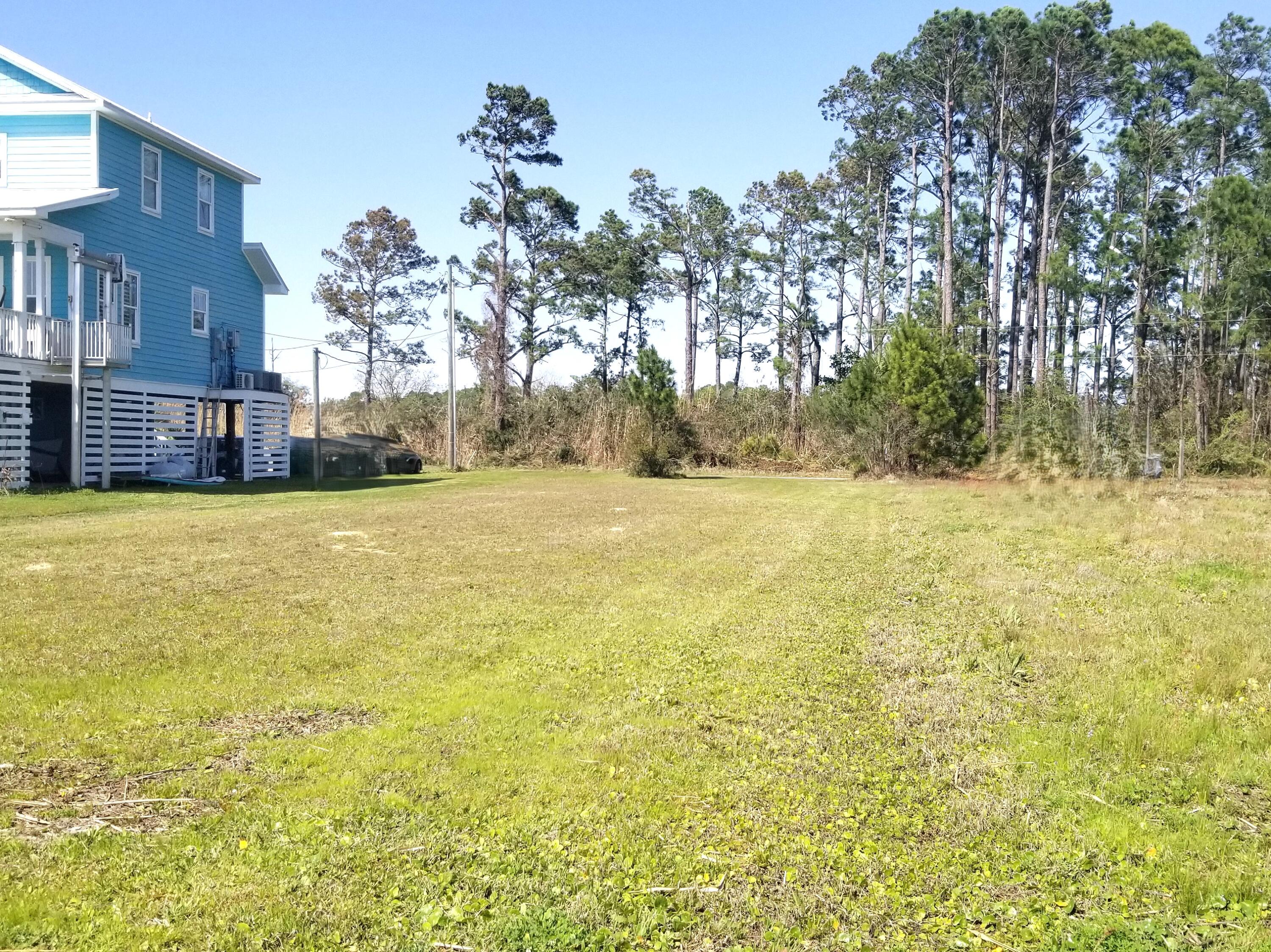 554 Beatrice Point Road Freeport, FL 32439 - Photo 14 of 24 a view of a pool with a yard