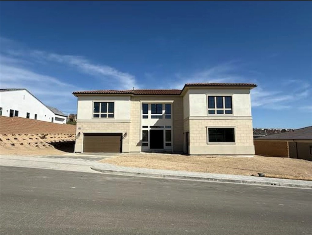 a view of a house with a street