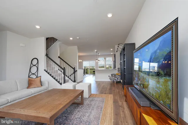 a view of a living room and a wooden floor