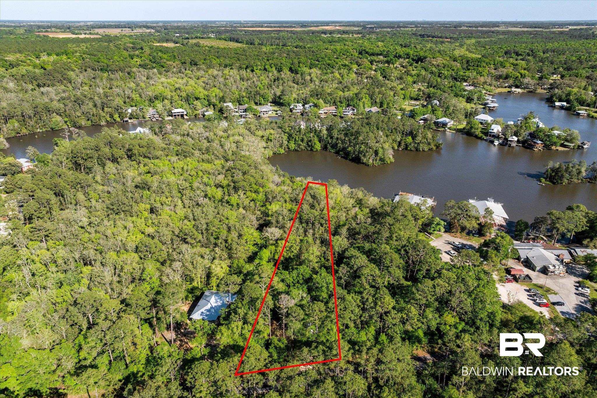 16620 Ferry Road Fairhope, AL 36532 - Photo 10 of 28 Drone / aerial view with a wooded view and a water view