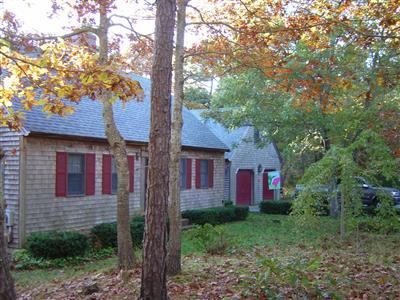 a front view of a house with yard