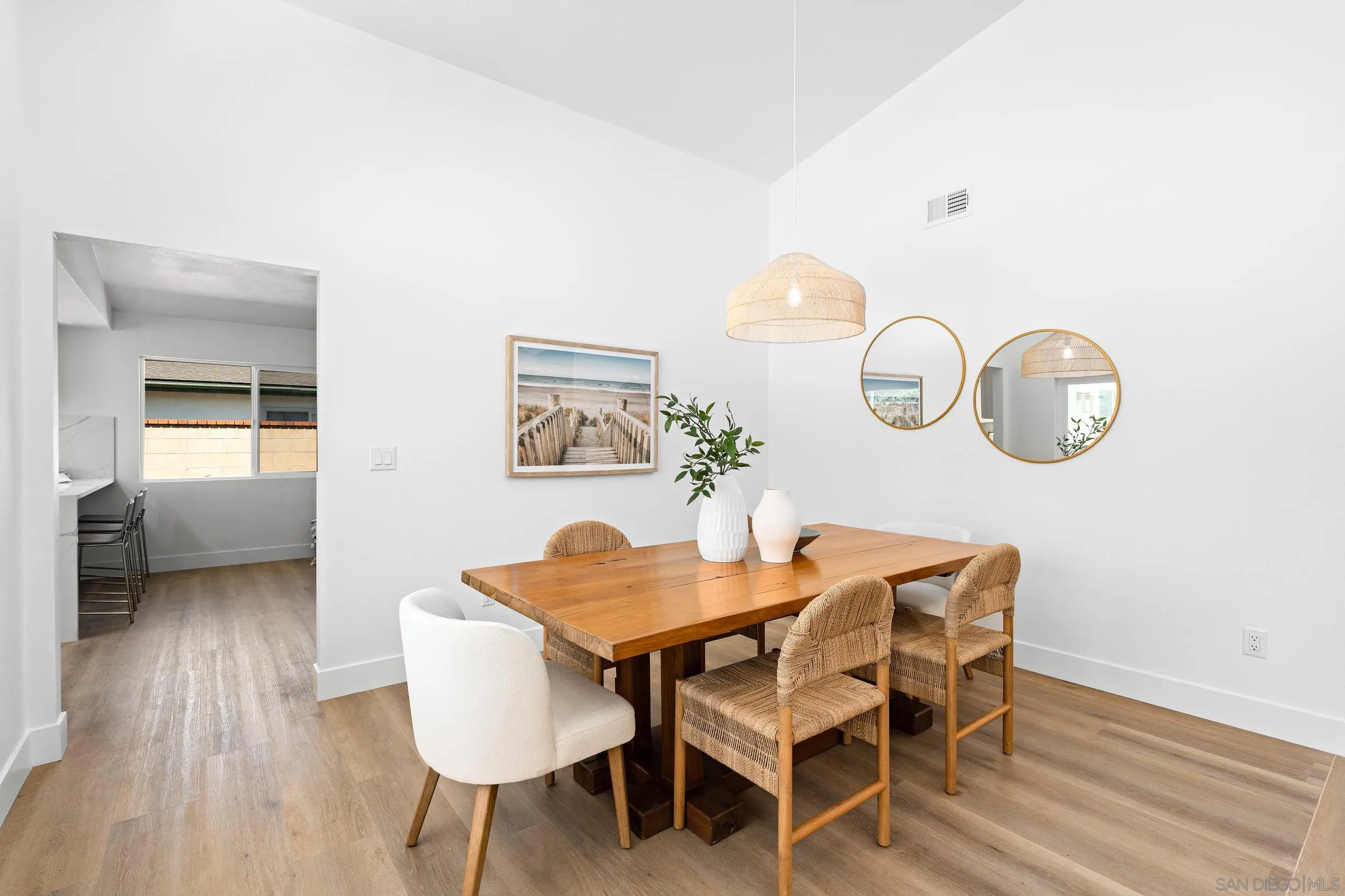 1621 Downs Street Oceanside, CA 92054 - Photo 12 of 38 a view of a dining room with furniture and wooden floor