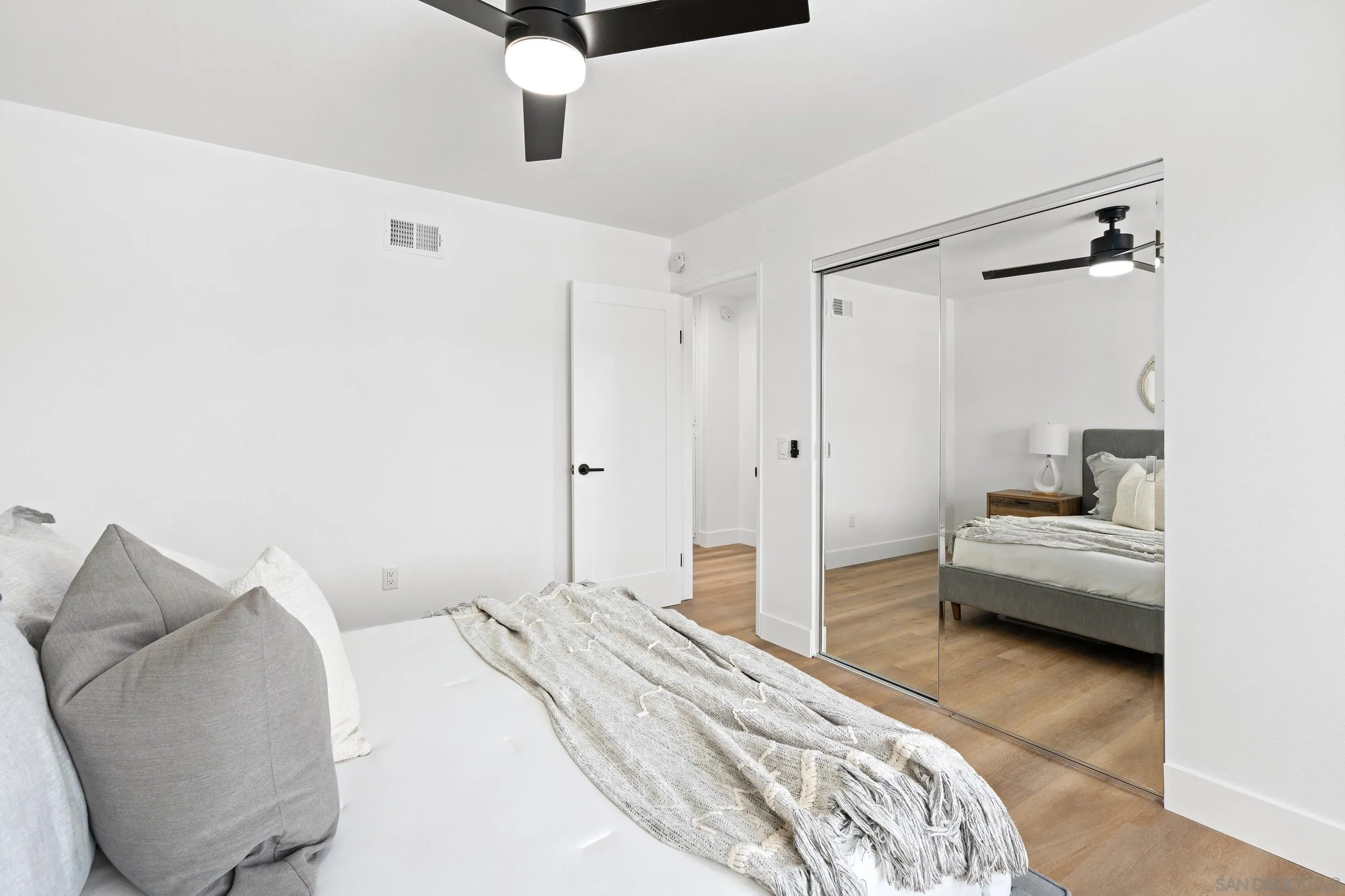 1621 Downs Street Oceanside, CA 92054 - Photo 20 of 38 a bedroom with a bed and a couch