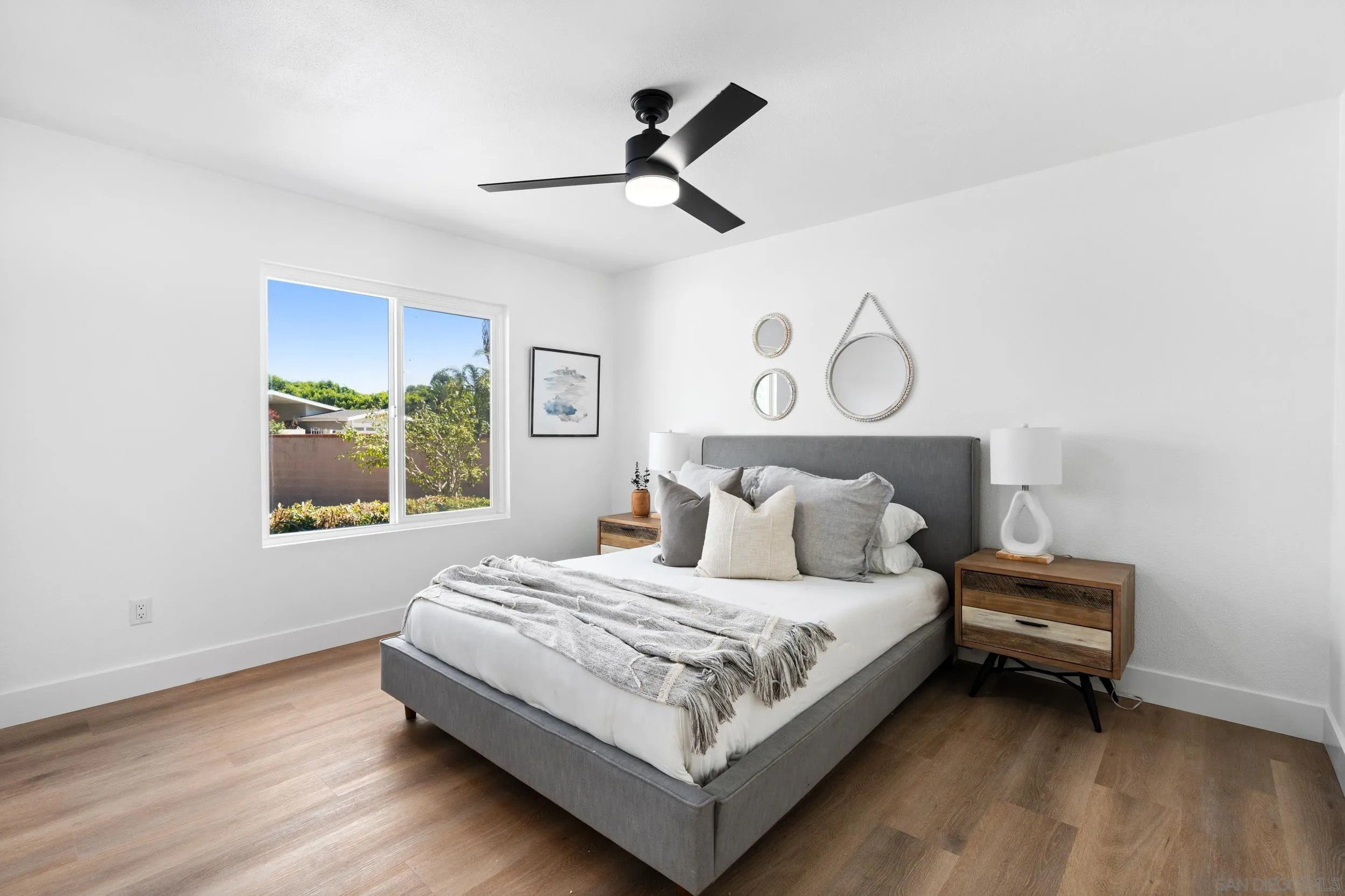 1621 Downs Street Oceanside, CA 92054 - Photo 21 of 38 a bedroom with a bed and window