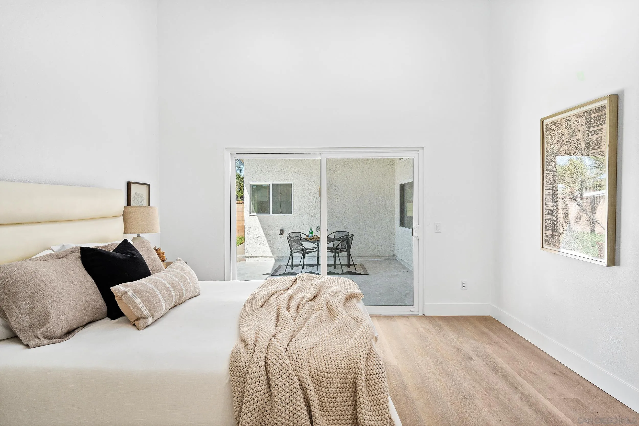 1621 Downs Street Oceanside, CA 92054 - Photo 27 of 38 a bed room with a bed and a balcony