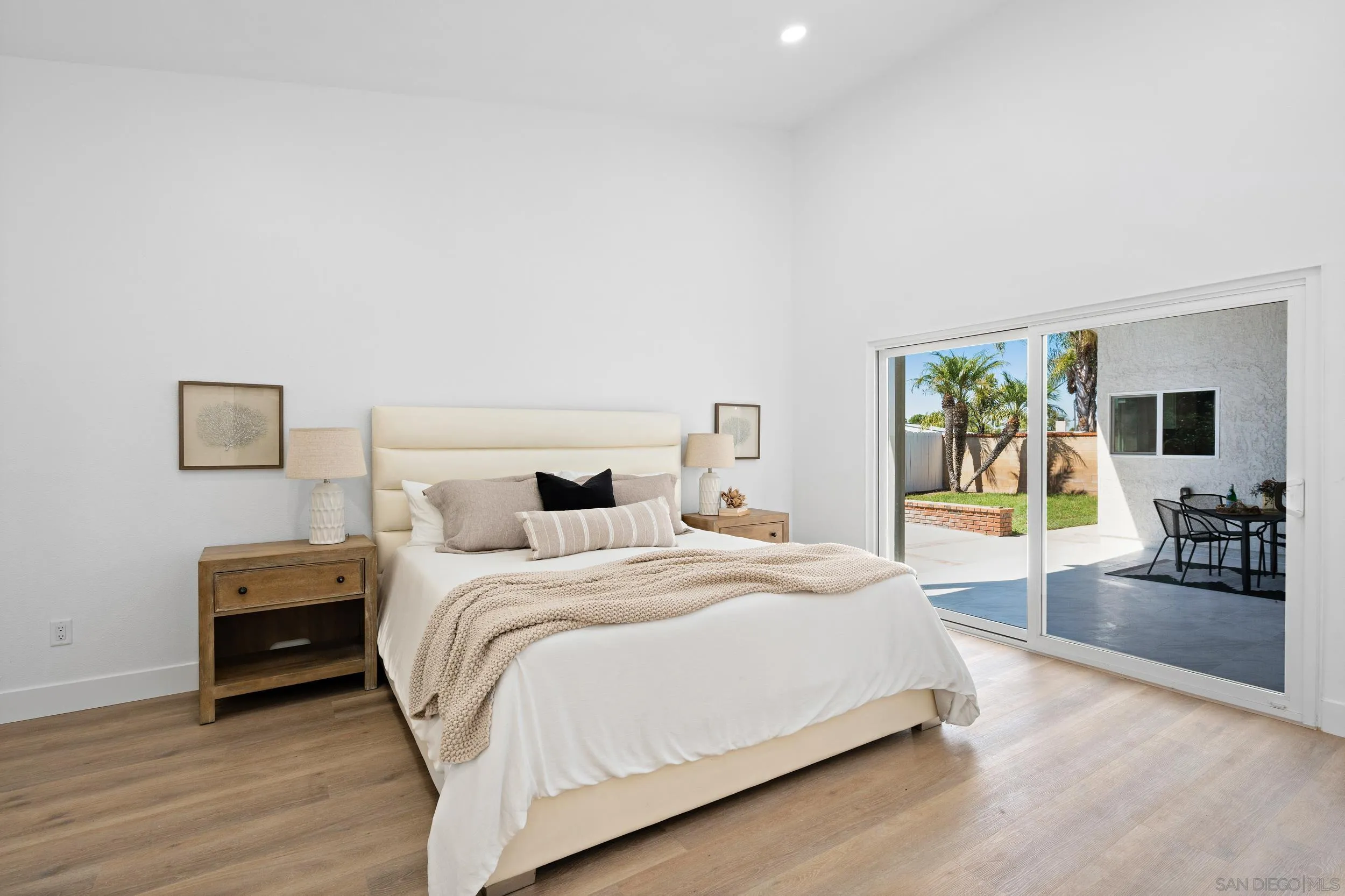 1621 Downs Street Oceanside, CA 92054 - Photo 28 of 38 a bedroom with a large bed and a flat screen tv