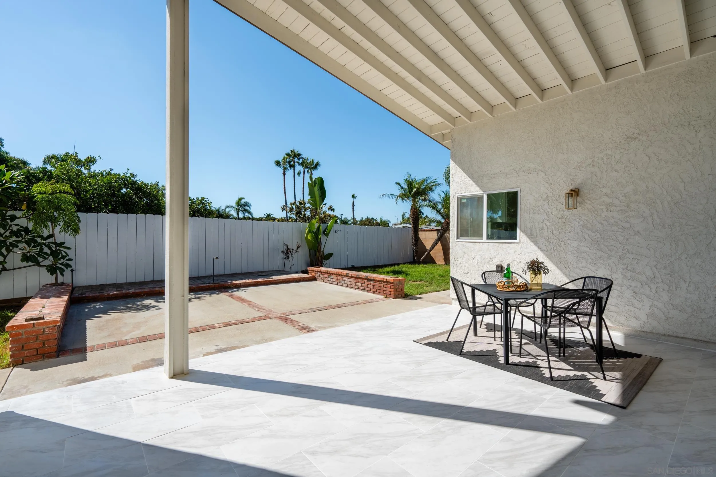 1621 Downs Street Oceanside, CA 92054 - Photo 29 of 38 a patio with table and chairs and potted plants