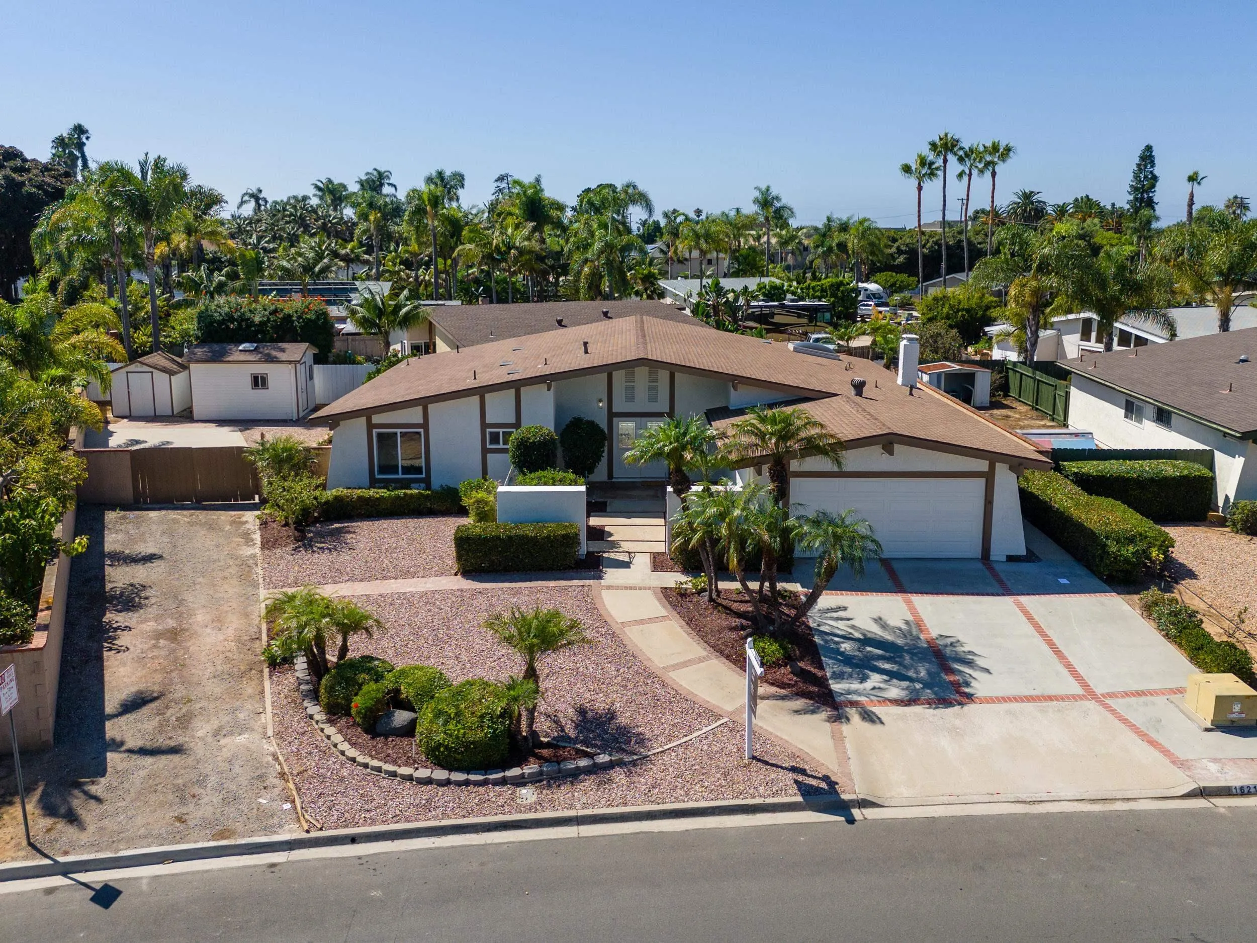 1621 Downs Street Oceanside, CA 92054 - Photo 3 of 38 a view of a patio with table and chairs potted plants