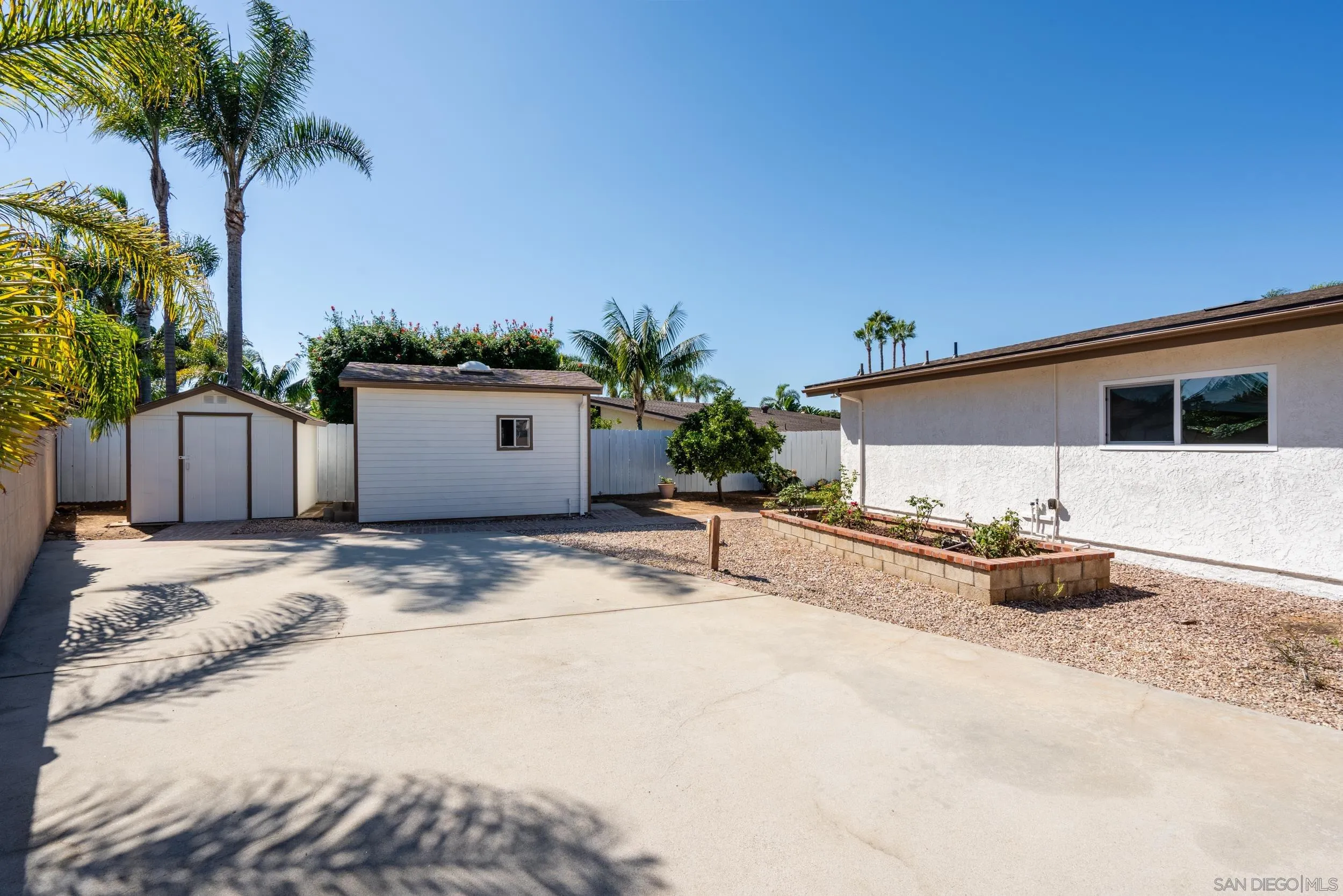 1621 Downs Street Oceanside, CA 92054 - Photo 34 of 38 a view of a house with backyard and a garden