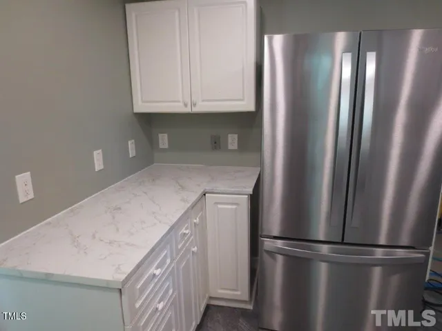 a living room with lots of furniture and a rug