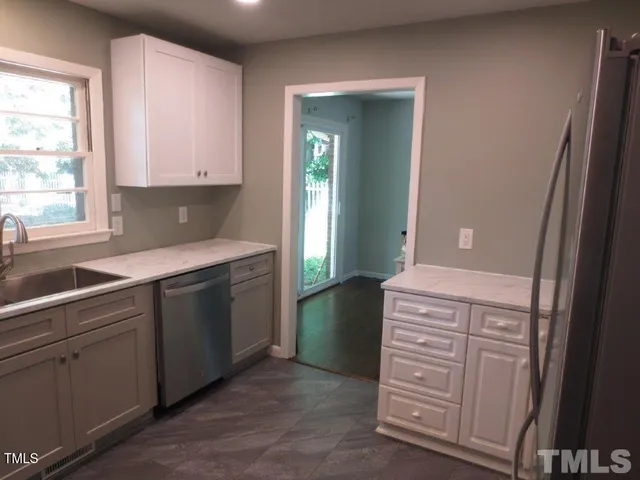 a kitchen with a sink and a window