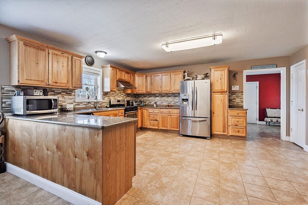 1391 Albion Road Winslow, ME 04901 - Photo 10 of 39 Kitchen towards breezeway