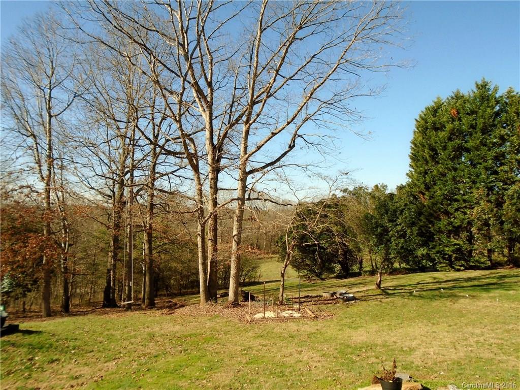 3336 Rocky Ridge Road Newton, NC 28658 - Photo 22 of 24 a view of a swimming pool with an trees