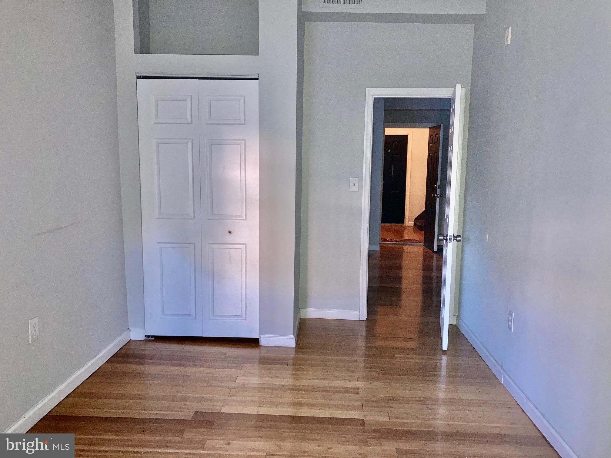 4825 Baltimore Avenue, Unit 4 Philadelphia, PA 19143 - Photo 5 of 10 a view of a hallway with wooden floor and closet