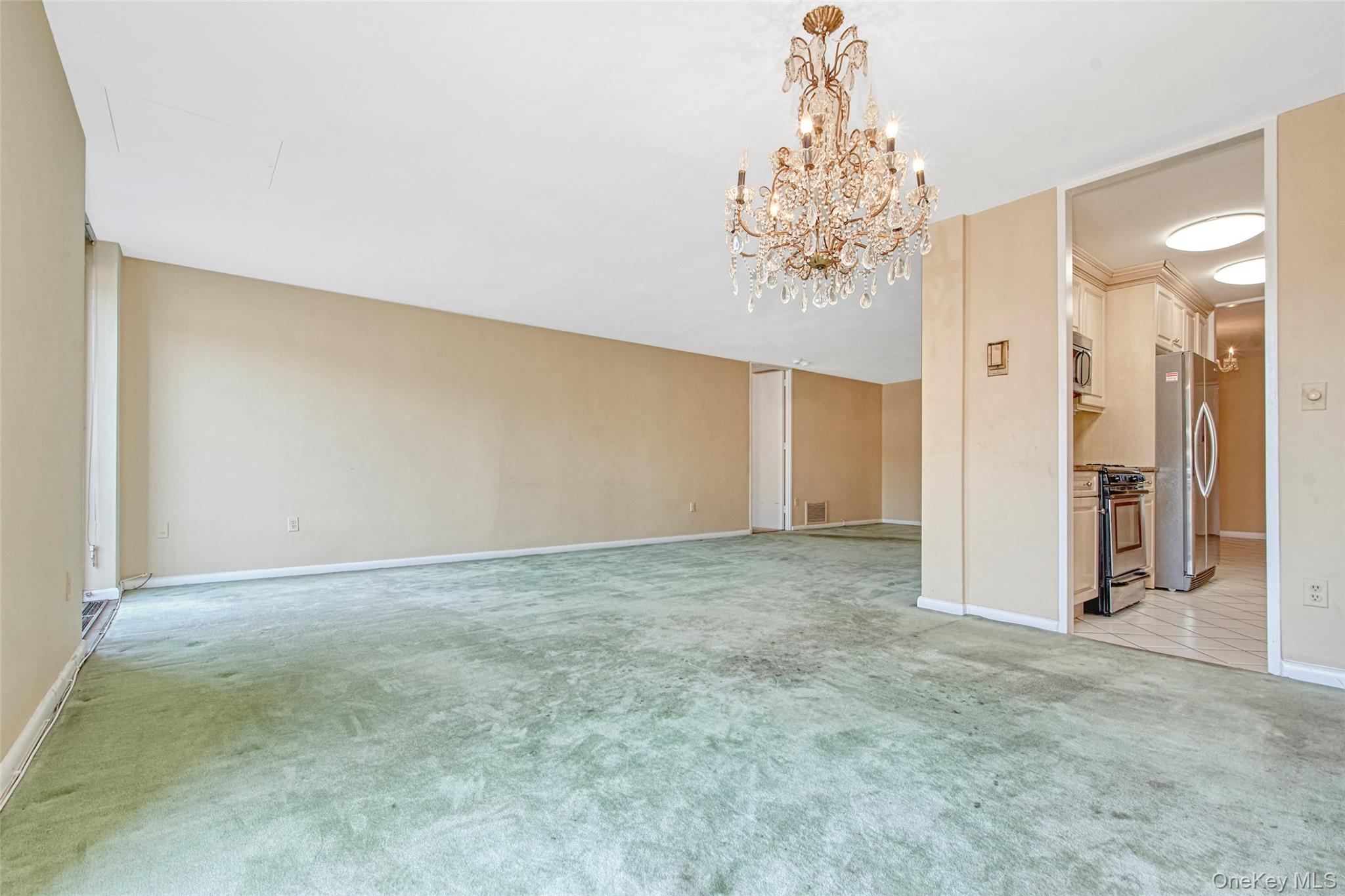 720 Milton Road, Unit WEST BUILDING 2E Rye, NY 10580 - Photo 9 of 19 Dining room into living room and Kitchen