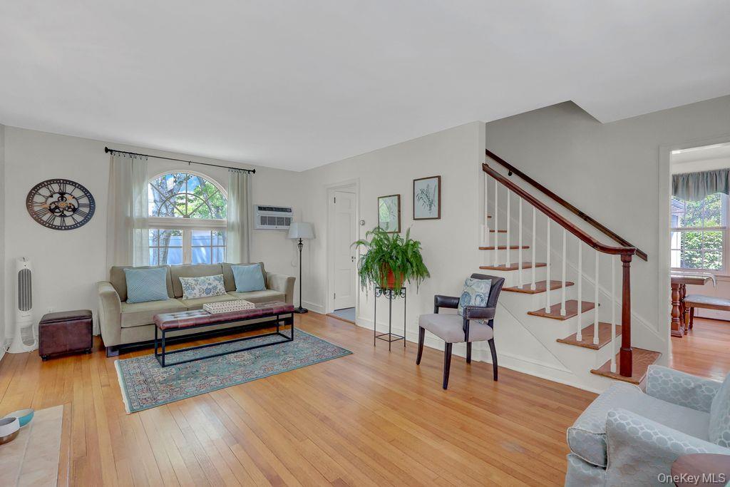 5 Newell Road Merrick, NY 11566 - Photo 3 of 19 a living room with furniture and a wooden floor