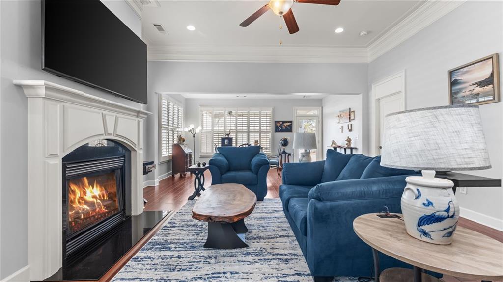 3418 Locust Cove Road Gainesville, GA 30504 - Photo 11 of 61 a living room with furniture and a fireplace