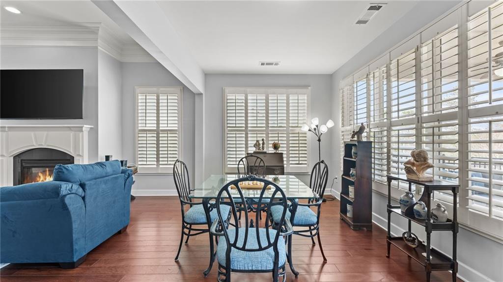 3418 Locust Cove Road Gainesville, GA 30504 - Photo 12 of 61 a view of a livingroom with furniture window and wooden floor