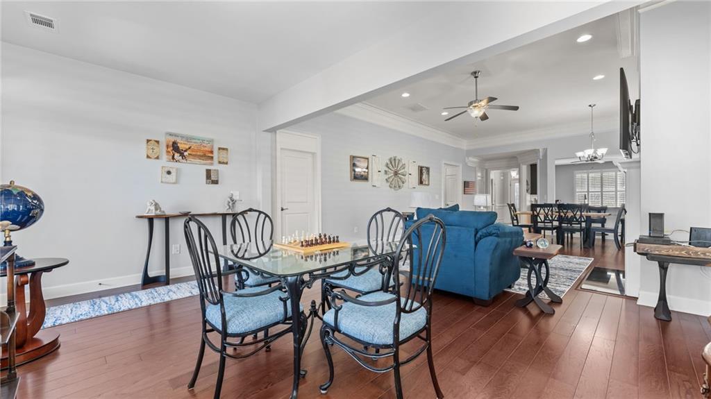 3418 Locust Cove Road Gainesville, GA 30504 - Photo 13 of 61 a view of a dining room with furniture and wooden floor