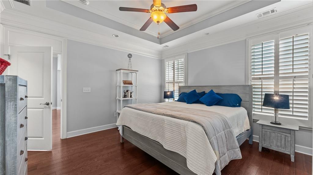 3418 Locust Cove Road Gainesville, GA 30504 - Photo 15 of 61 a bedroom with a bed and a chandelier