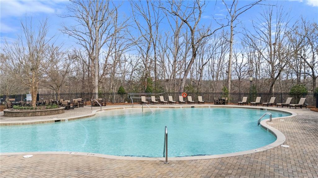 3418 Locust Cove Road Gainesville, GA 30504 - Photo 36 of 61 a view of a swimming pool and lounge chairs in back yard