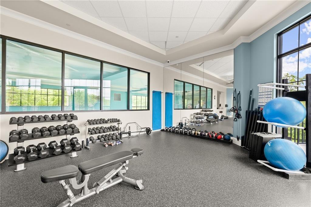 3418 Locust Cove Road Gainesville, GA 30504 - Photo 49 of 61 a bedroom with furniture and large window