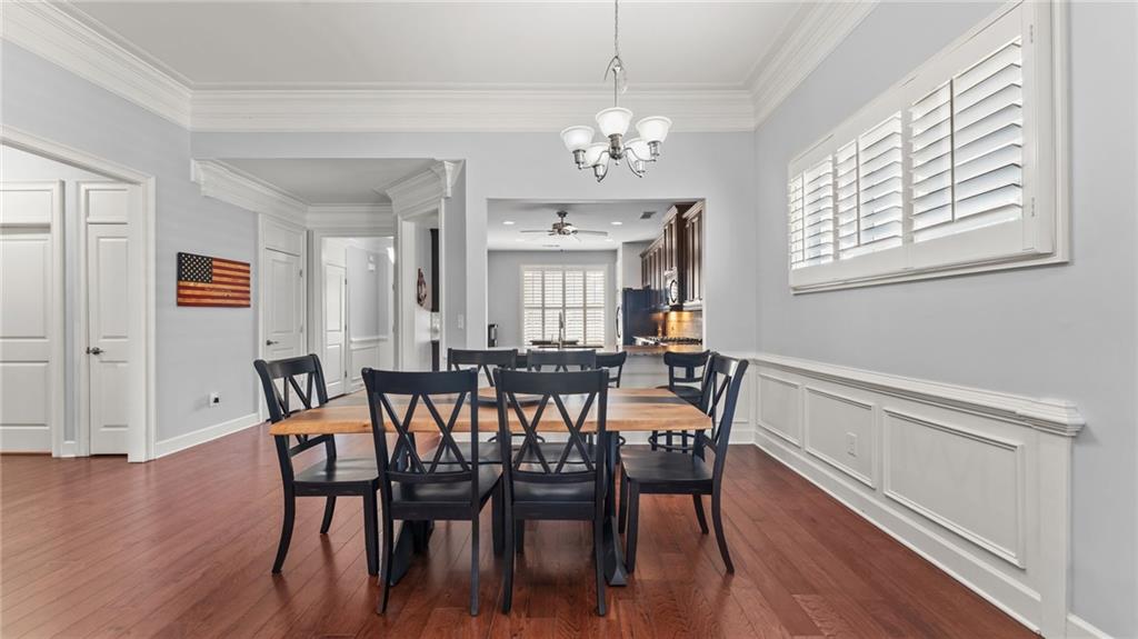 3418 Locust Cove Road Gainesville, GA 30504 - Photo 8 of 61 a view of a dining room with furniture wooden floor and chandelier