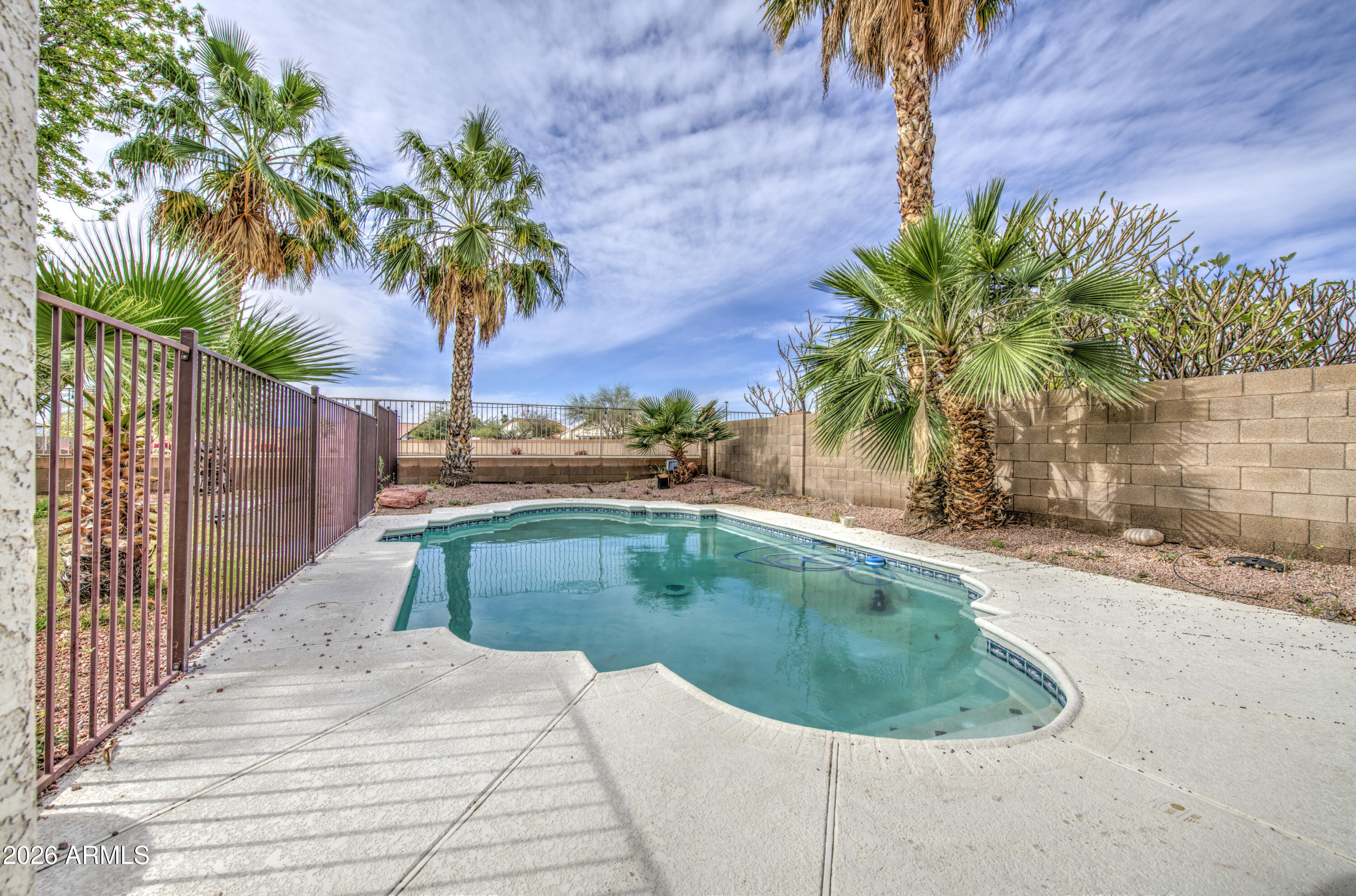 12403 West Monte Vista Road Avondale, AZ 85392 - Photo 48 of 63 a view of a swimming pool with a garden