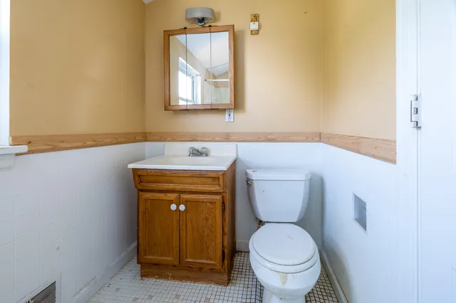 a bathroom with a toilet and a sink