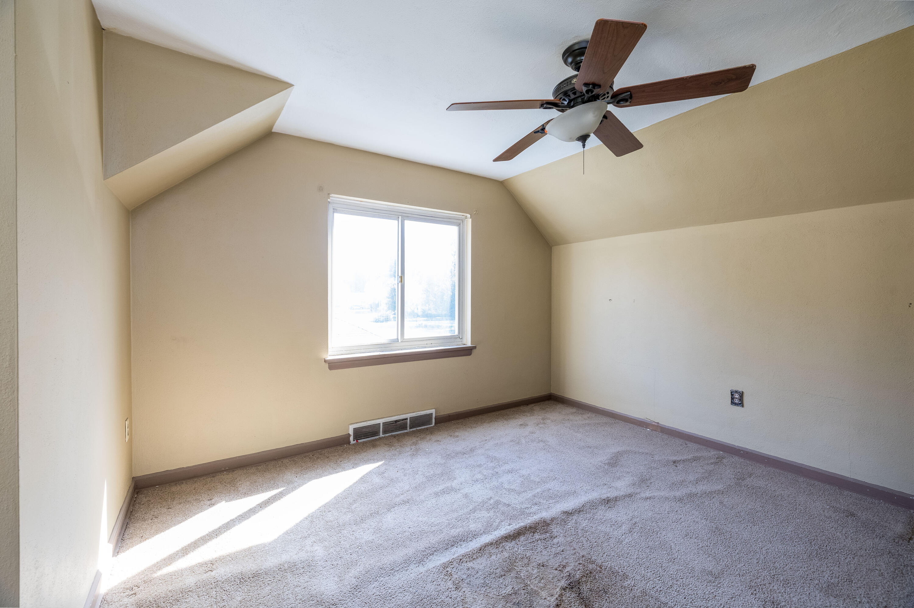 106 West Washington Street Kentland, IN 47951 - Photo 18 of 31 a view of room with a ceiling fan and window