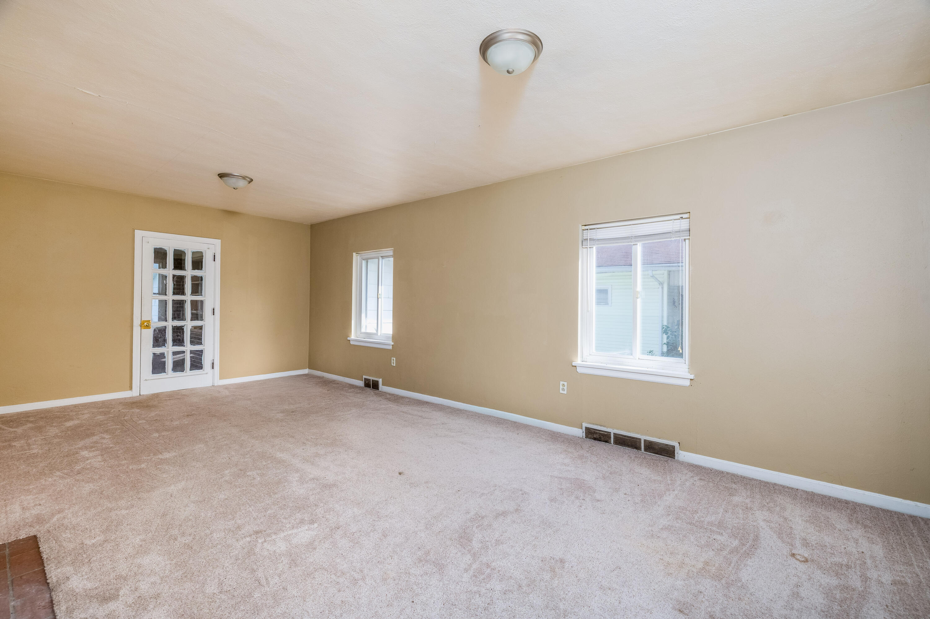 106 West Washington Street Kentland, IN 47951 - Photo 2 of 31 a view of an empty room with a window