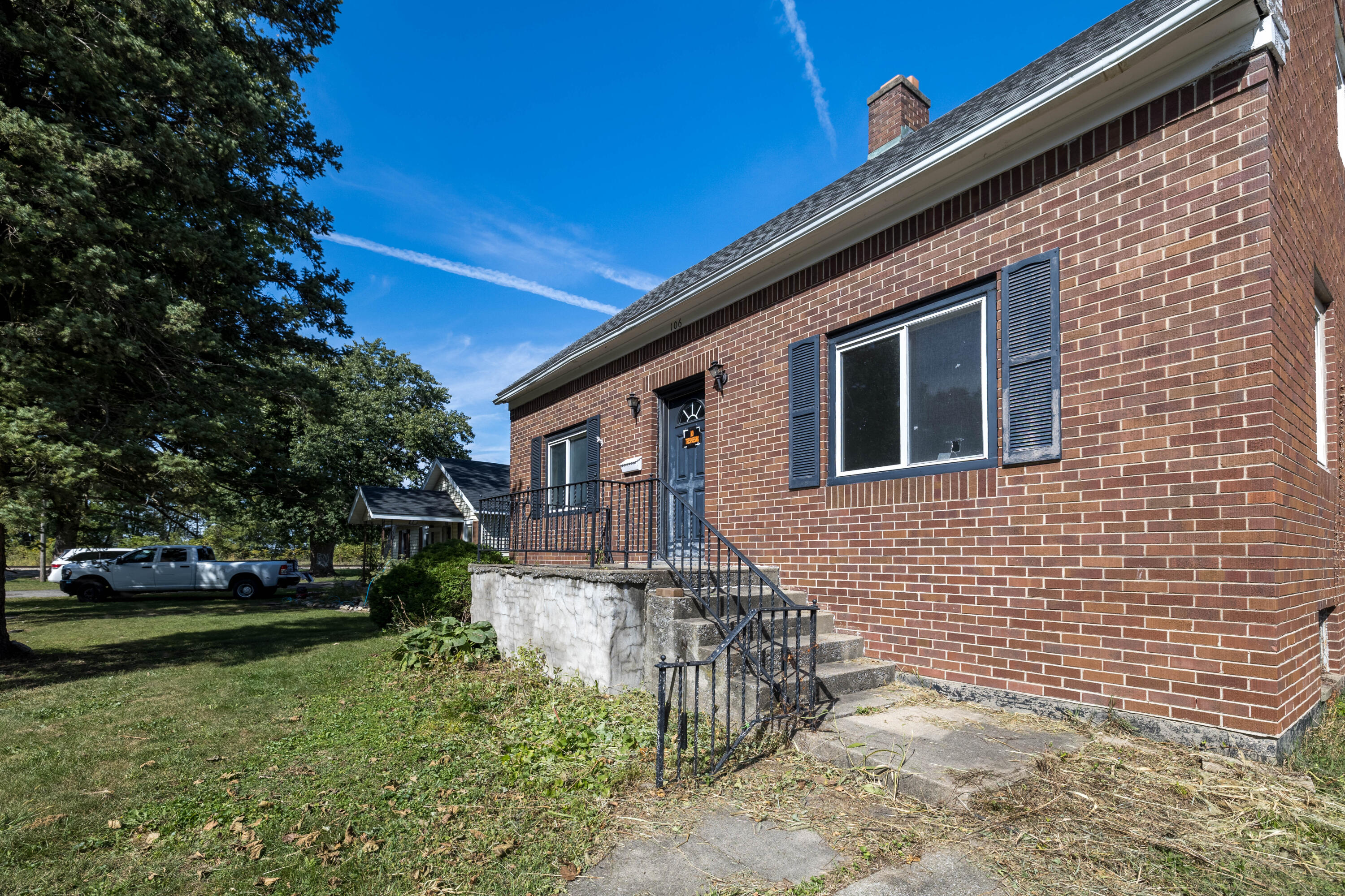 106 West Washington Street Kentland, IN 47951 - Photo 26 of 31 a front view of a house with a yard