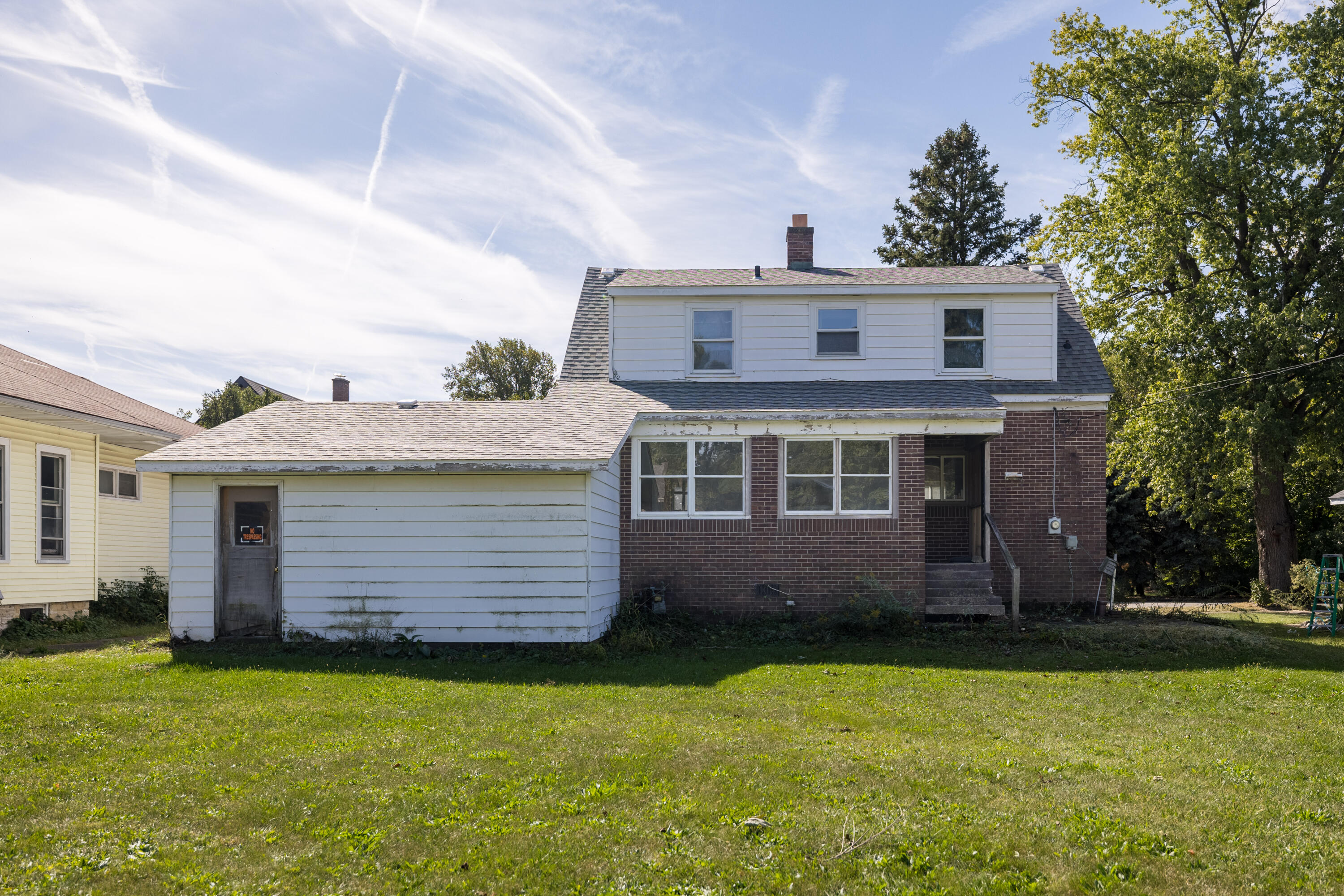 106 West Washington Street Kentland, IN 47951 - Photo 29 of 31 a front view of a house with a garden