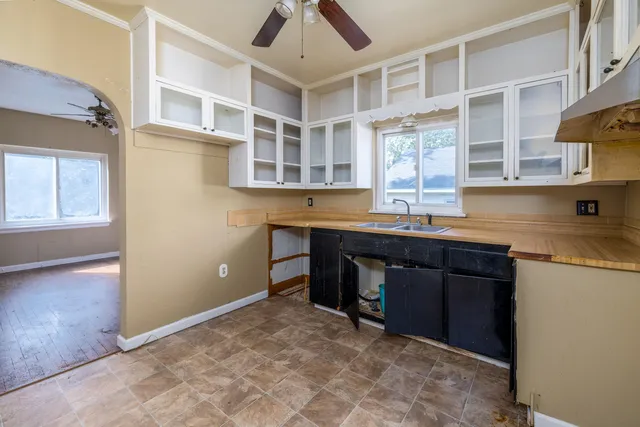 a kitchen with stainless steel appliances granite countertop a stove and a sink