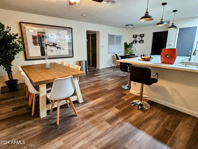 a bathroom with a sink a toilet and shower curtain