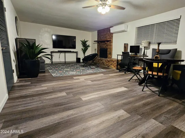 a bedroom with two beds and painting on the wall