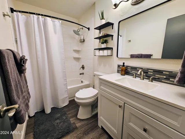 a kitchen with stainless steel appliances a stove and cabinets
